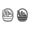 Basket with loaves and apple line and solid icon, food concept, Picnic basket full of delicious fruits and bread sign on Royalty Free Stock Photo