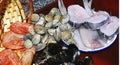 Basket with mussels, prawns, clams and hake on the kitchen