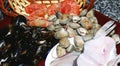 Basket with mussels, prawns, clams and hake on the kitchen