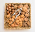 Basket with nuts and nutcracker Royalty Free Stock Photo