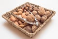 Basket with nuts and nutcracker Royalty Free Stock Photo