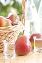 A basket with pears and pear schnapps Royalty Free Stock Photo