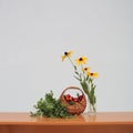 Basket with plums and flowers Royalty Free Stock Photo