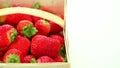 Basket of red delicious strawberries on white background