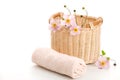 Basket, rolled towel and anemones