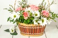 Basket with roses and chrysanthemums