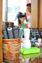 Basket with round hair brushes mirror on wall