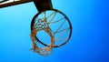 Basket with ruined net seen from below in the morning sun Royalty Free Stock Photo