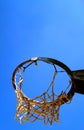 Basket with ruined net seen from below in the morning sun Royalty Free Stock Photo