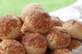 A basket of small breads on top of a buffet table