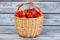 Basket of strawberries on vintage wood. Royalty Free Stock Photo