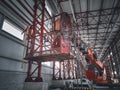 Basket of telehandler inside of hangar Royalty Free Stock Photo