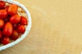 Basket tomato mini red cherry many vegetables on a wooden background copy space Royalty Free Stock Photo