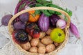 Basket with various vegetables. Potatoes, beets, tomatoes, shallots, eggplants. Country style. Top view.