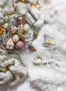 Basket with vintage christmas decorations on a fluffy white carpet, top view. Christmas background Royalty Free Stock Photo