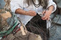 Craftsman working outdoors manufacturing an iron basket