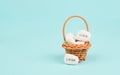 Basket with white pebbles, words like luck and love standing in german language on the stones, gift with good wishes Royalty Free Stock Photo