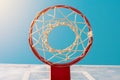 Basketball backboard with ring and hoops on outdoor court