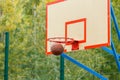 Basketball backboards with a ball in the basket in the summer on city playground Royalty Free Stock Photo