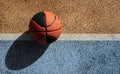 Basketball ball in a colorful street basketball court. Copy space Royalty Free Stock Photo