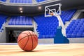 Basketball ball on basketball court in an empty basketball arena