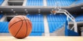 Basketball ball on basketball court in an empty basketball arena