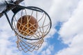 Basketball ball enters the basket in a swish shoot