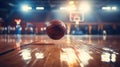 Basketball ball in motion, jumping on empty basketball stadium, arena indoors with sunlight coming from windows. Sport