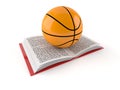 Basketball ball on open book