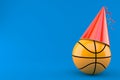 Basketball ball with party hat