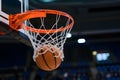 Basketball ball sinks into hoop, victory and achievement concept Royalty Free Stock Photo