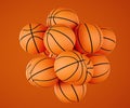 Many classic orange basketball balls isolated on orange background Royalty Free Stock Photo