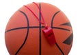 Basketball ball and sports whistle isolated on white.