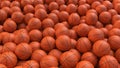 Basketball balls background. Many orange basketball balls with realistic dimple texture lying in a pile