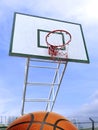 Basketball and basketball hoop in the city and blue sky Royalty Free Stock Photo