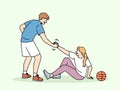 Basketball caviar helps fallen girl to stand up, showing team solidarity with injured opponent Royalty Free Stock Photo