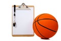 Basketball and clipboard on white Royalty Free Stock Photo