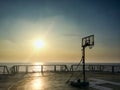 Basketball court backboard on helideck in seismic vessel ship during sunset in Andaman Sea for oil and gas survey with sky Royalty Free Stock Photo