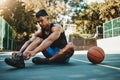 Basketball court, man and shoes prepare for training at recreation and athlete facility. Sports, exercise and fitness Royalty Free Stock Photo