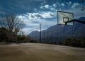 Open Basketball Court between Mountains in Greece Royalty Free Stock Photo