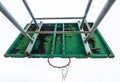 Basketball court with old wood backboard.blue sky and white clouds on background. Old Stadium.