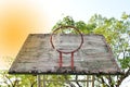 Basketball court with old wood backboard.blue sky and white clouds on background. Old Basin Stadium