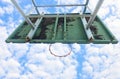 Basketball court with old wood backboard.blue sky and white clouds on background. Old Stadium.