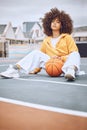 Basketball, court and sport woman portrait while sitting with ball. Stylish, edgy and afro lady looks cool in athletic Royalty Free Stock Photo