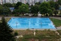 Basketball court wet from the rain in a residential area Royalty Free Stock Photo