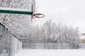 Basketball court in the winter. A lot of white snow