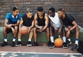 Basketball friends, rest together with phone and relax watch a funny video on smartphone after training on sports court Royalty Free Stock Photo