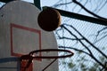 Basketball going through the basket at a sports arena intentional spotlight Royalty Free Stock Photo