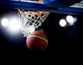 Basketball going through the hoop Royalty Free Stock Photo