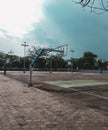 Basketball ground playing time with friends with the Cloudy blue sky